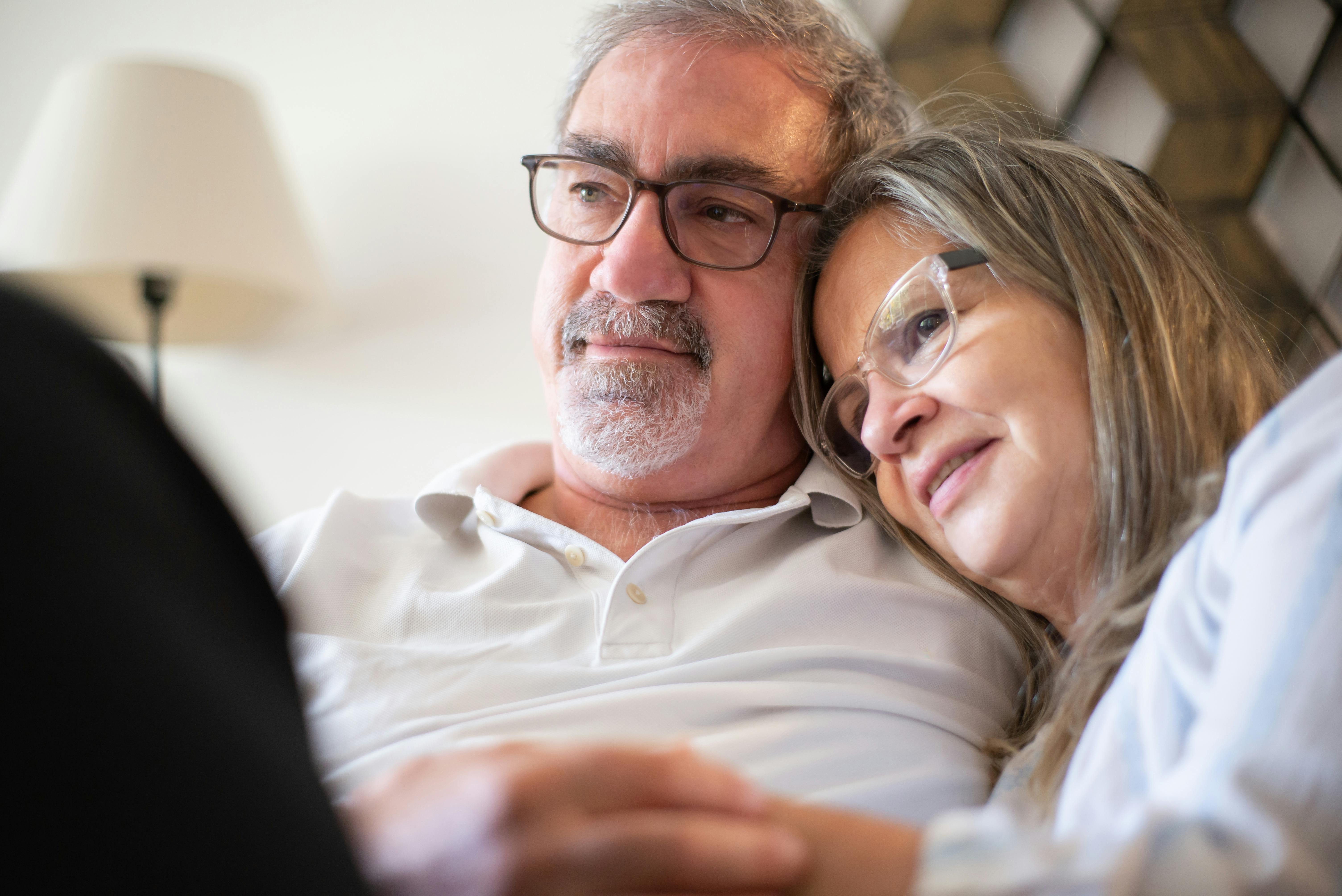 Happy couple reviewing Medicare options with an agent